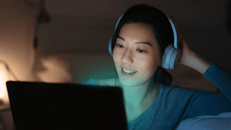 Person smiling at computer
